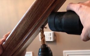 Drill away dried glue obstructing holes