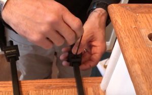 Place shoe on baluster and tighten 80%